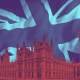 Stylised image of the Houses of Parliament and Big Ben in red tones, set against a textured, abstract Union Jack background in blue and purple.